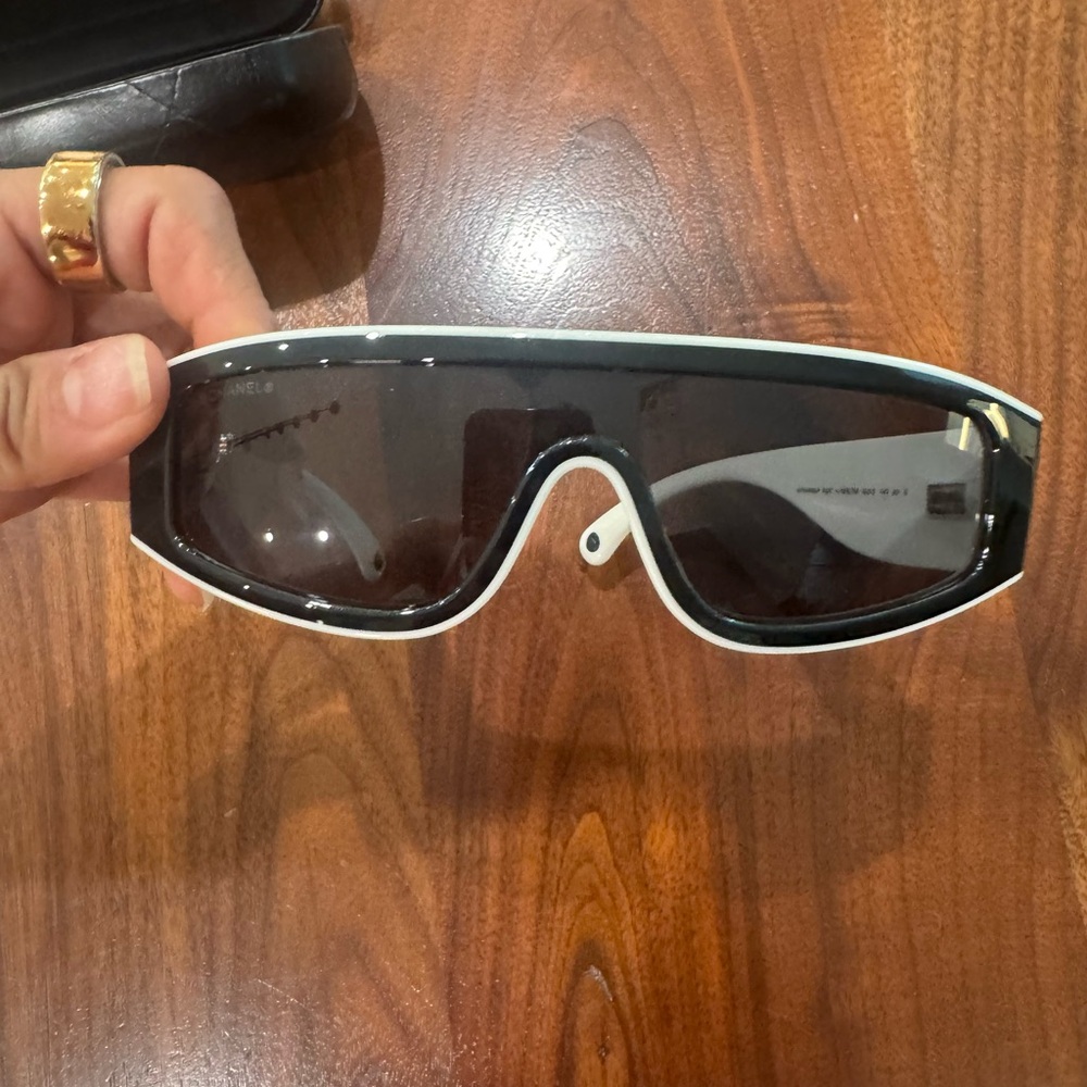 CHANEL Elegant Black Sunglasses with White Trim